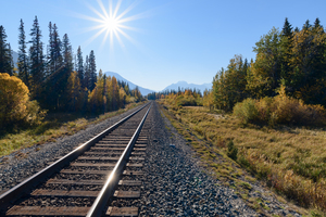 Banff train tracks with sun mountains 3