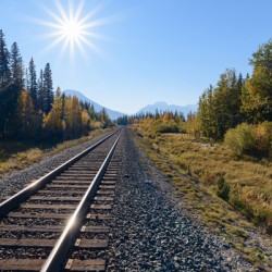 Banff train tracks with sun mountains 3